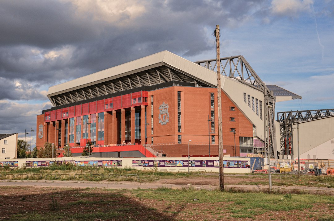 Anfield stadium exterior under cloudy sky