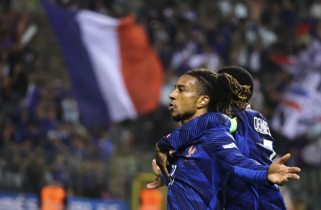Michael Olise celebrates his late goal for France