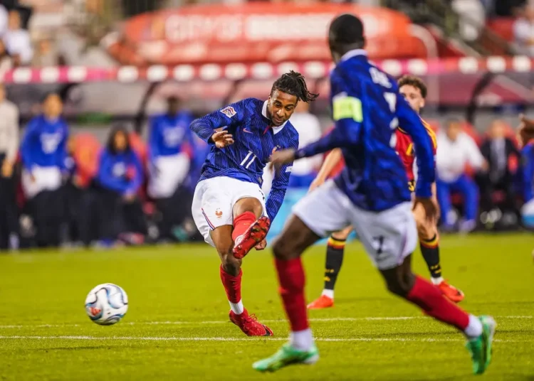 Michael Olise shoots for France against Belgium