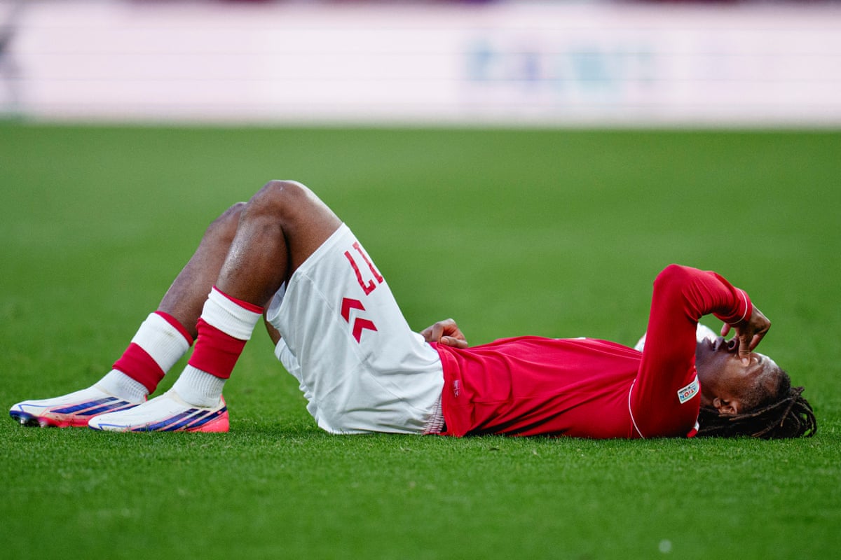 Patrick Dorgu lies on the turf after suffering an injury on international duty