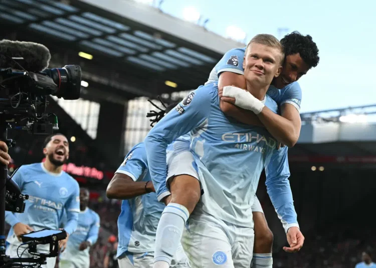 Manchester City players celebrate their 3–0 Premier League win against Liverpool at Anfield amid the club's financial verdict