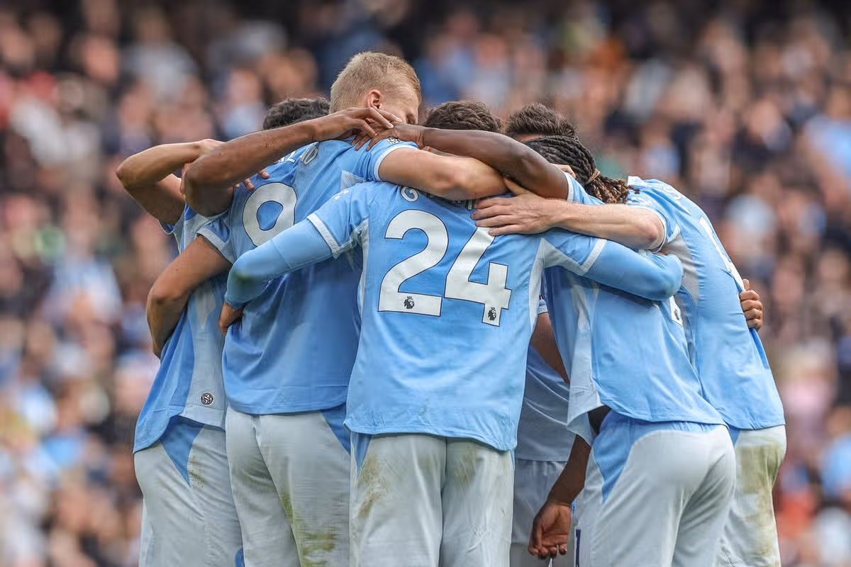 Manchester City players celebrate their 3–0 Premier League win against Liverpool at Anfield amid the club's financial verdict