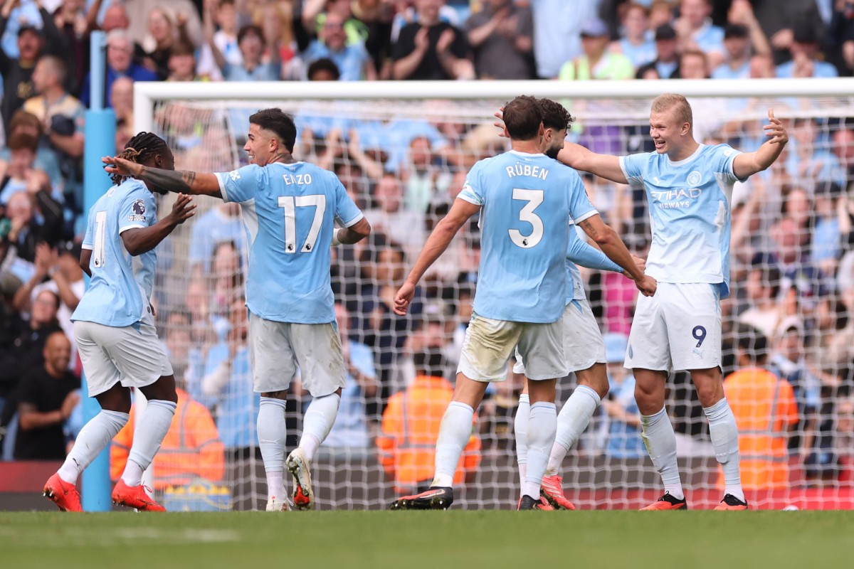 Manchester City players celebrate their 3–0 Premier League win against Liverpool at Anfield amid the club's financial verdict