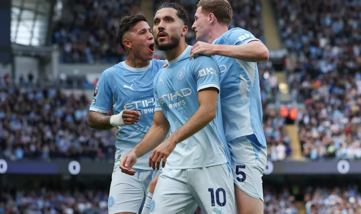 Manchester City players celebrate their 3–0 Premier League win against Liverpool at Anfield amid the club's financial verdict