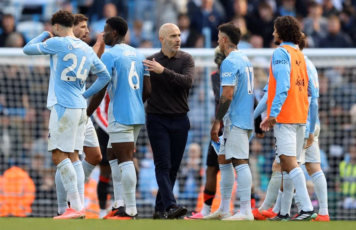 Manchester City players celebrate their 3–0 Premier League win against Liverpool at Anfield amid the club's financial verdict