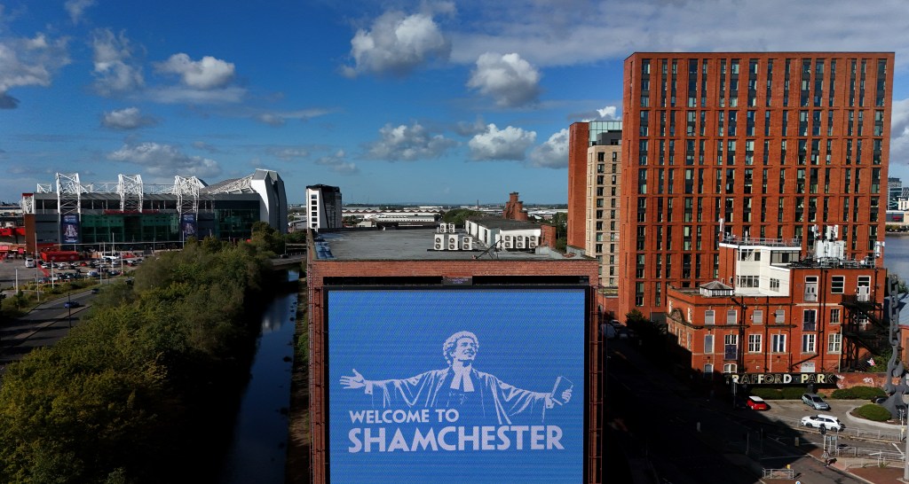 Manchester skyline and billboard following Manchester City's financial verdict